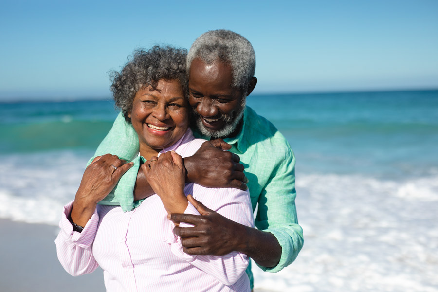 senior-couple-on-the-beach-mobile